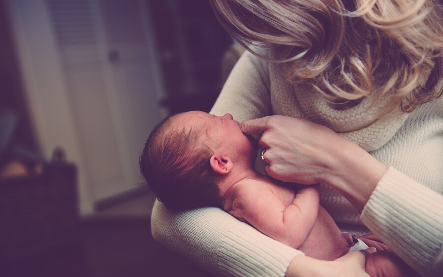 mother holding baby