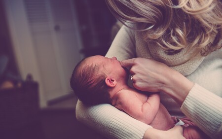 mother holding baby